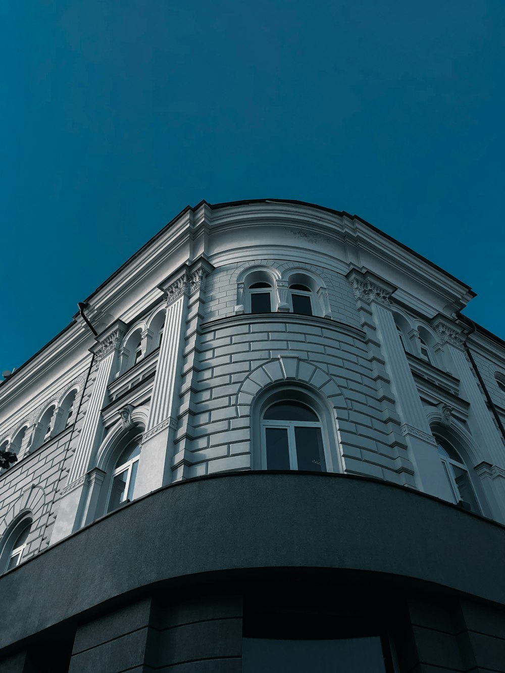 white concrete building under blue sky during daytime