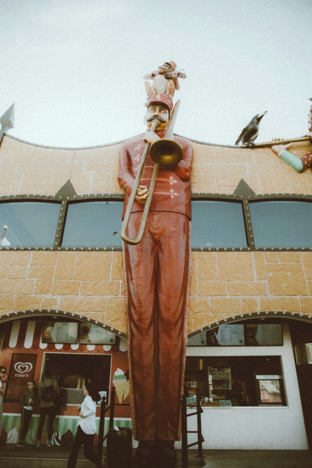 gold and red statue of man