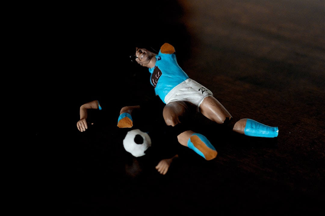 man in blue jersey shirt and white shorts