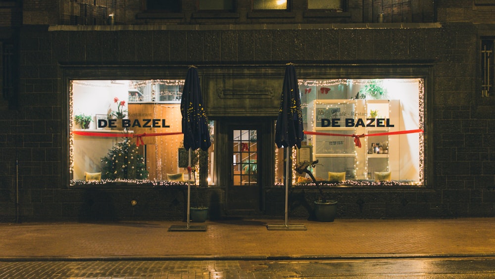 black and white store front during night time