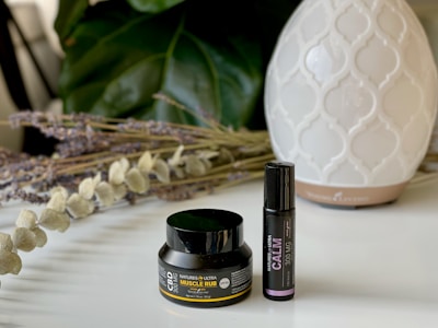 Relaxing scene with CBD creams and balms displayed on a rustic table
