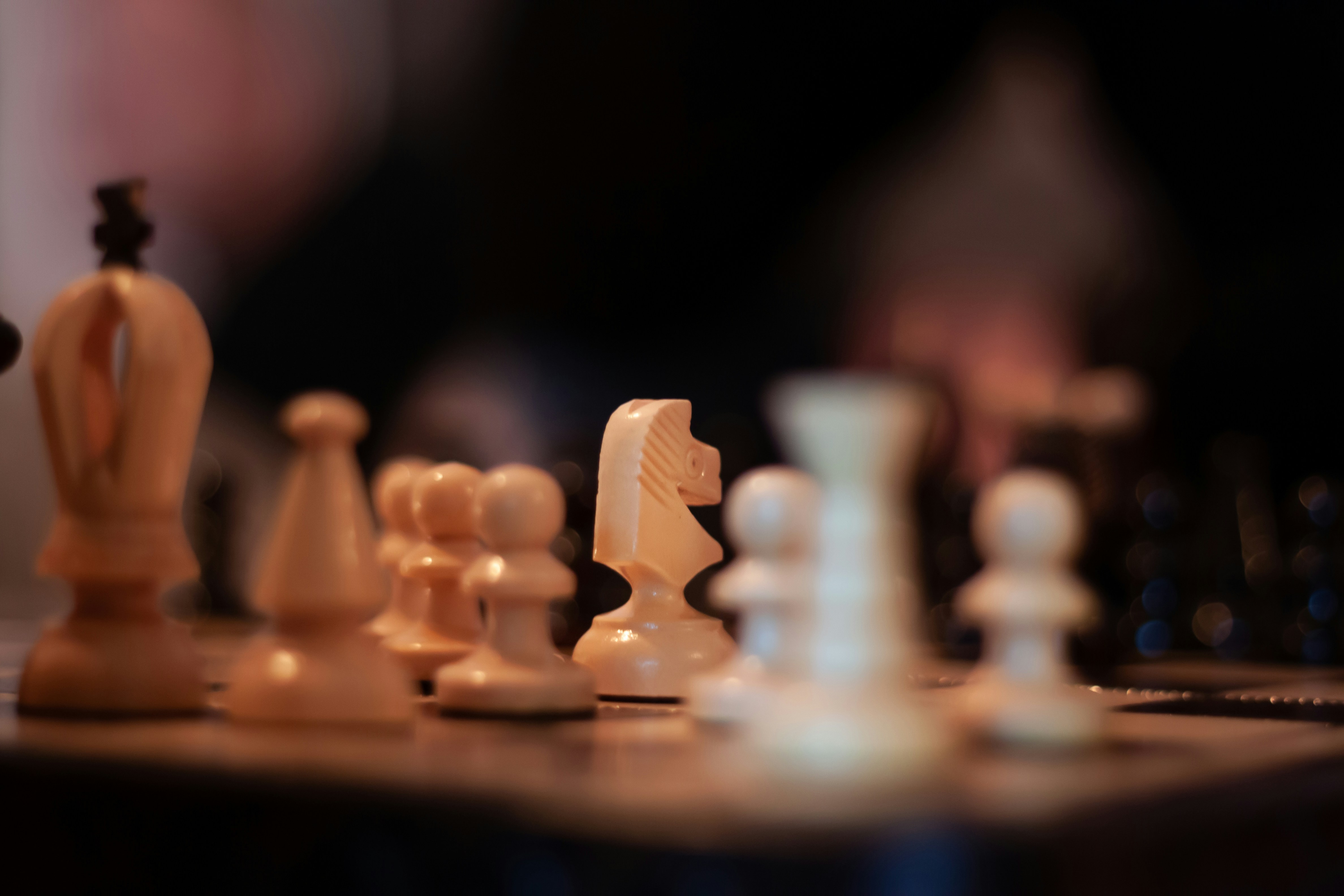 white chess pieces on chess board