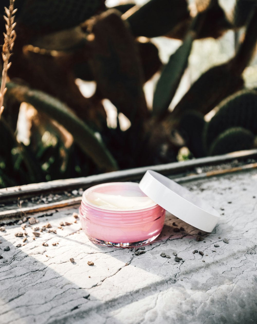 a jar of cream sitting on top of a table