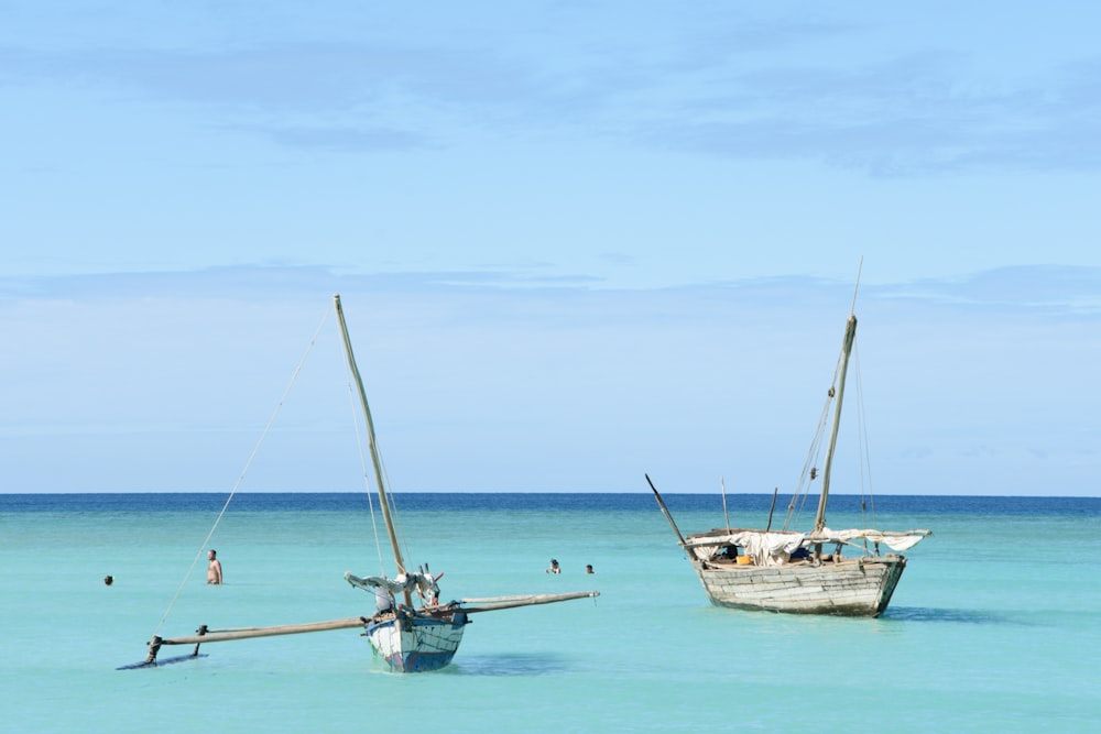 white and brown boat on sea during daytime