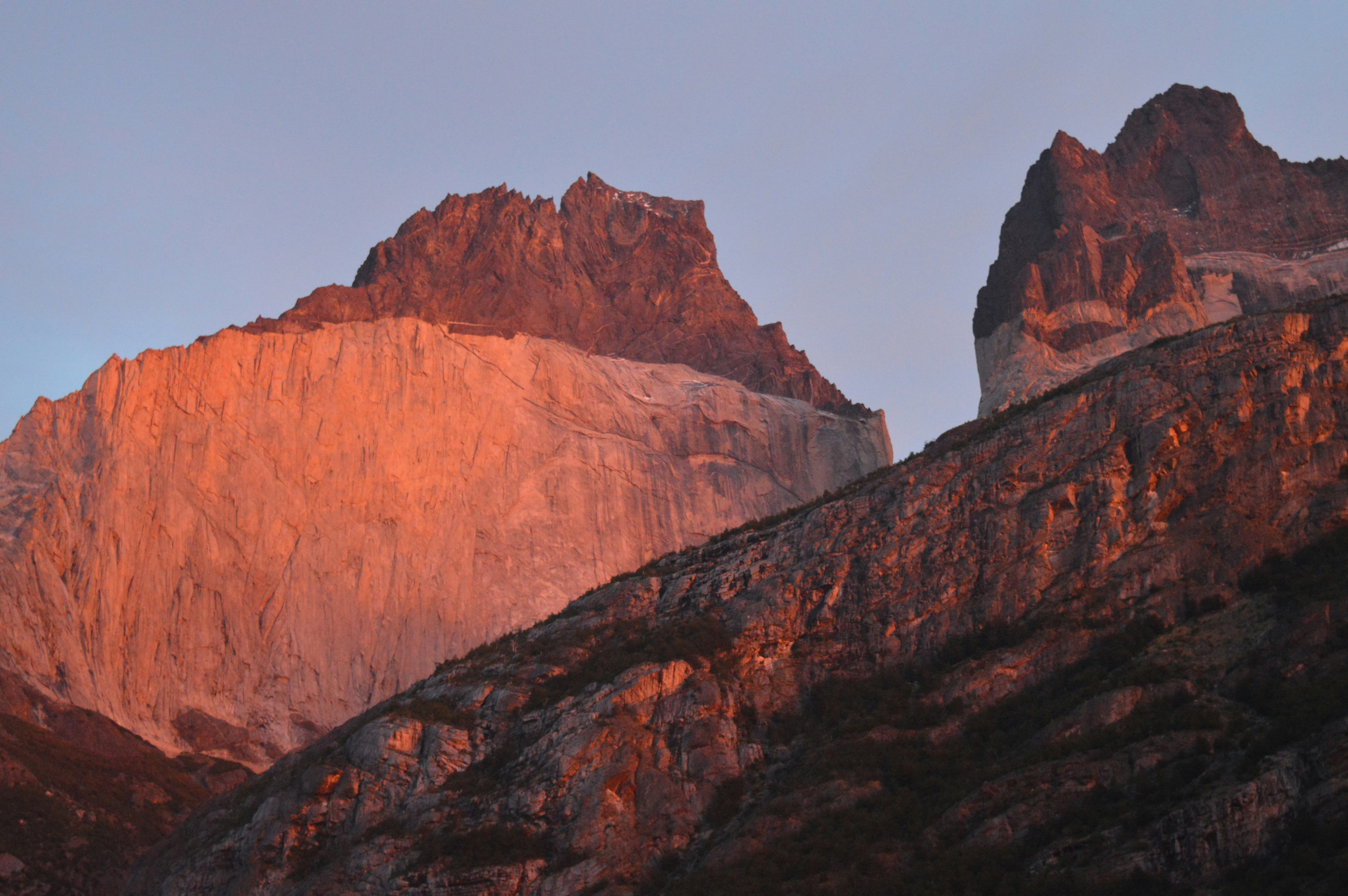brown rocky mountain under gray sky