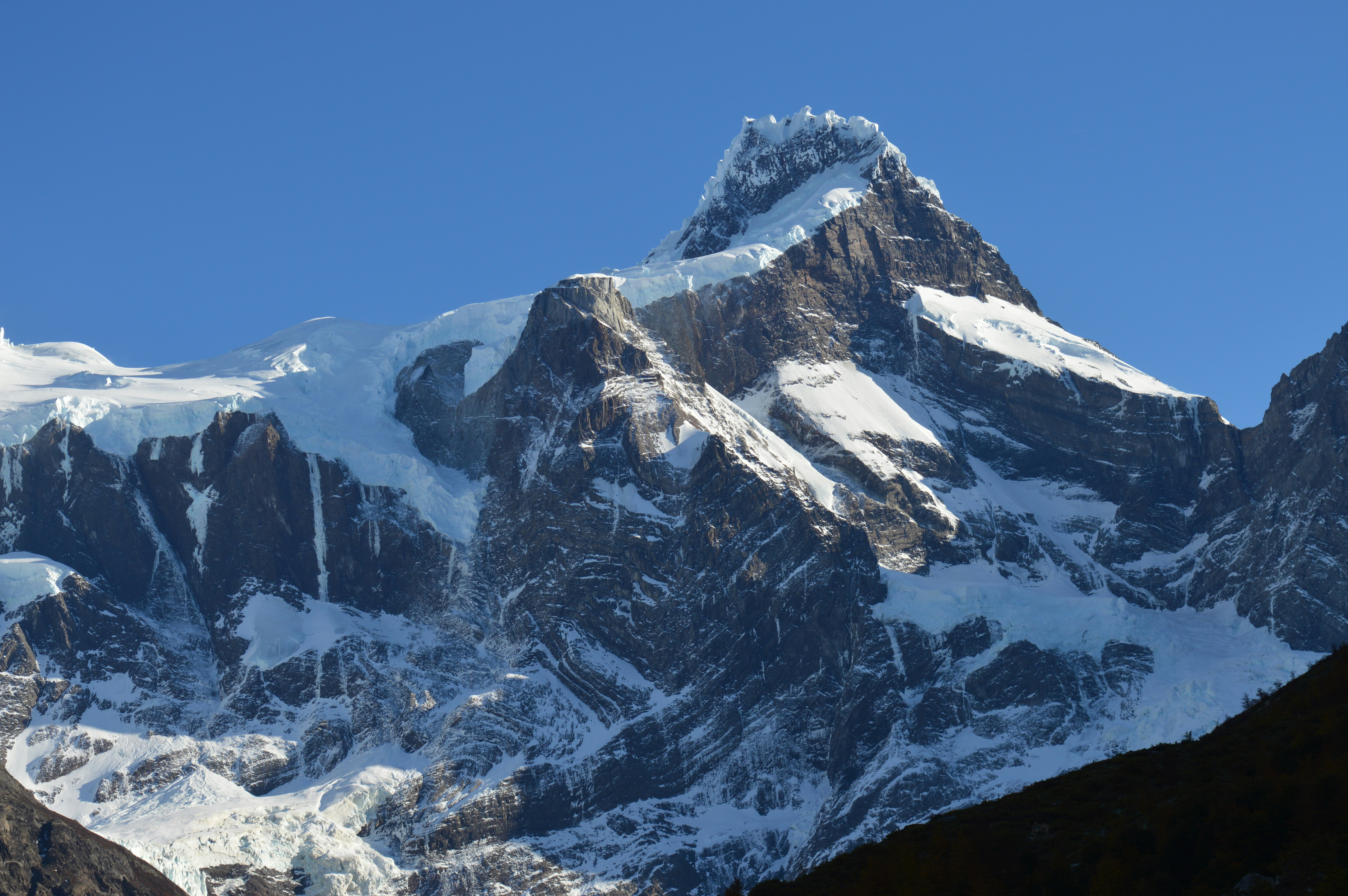 snow covered mountain under blue sky during daytime