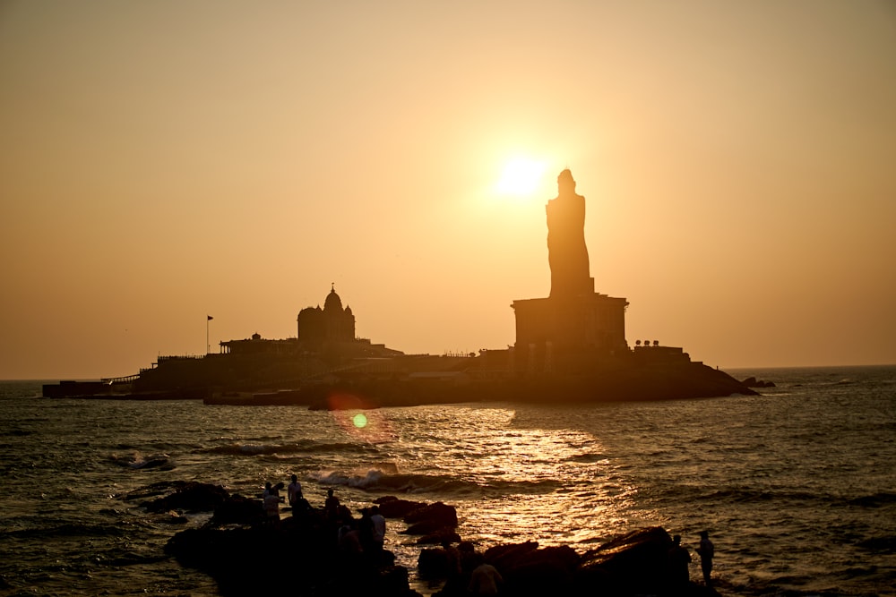 silhouette of statue of liberty during sunset