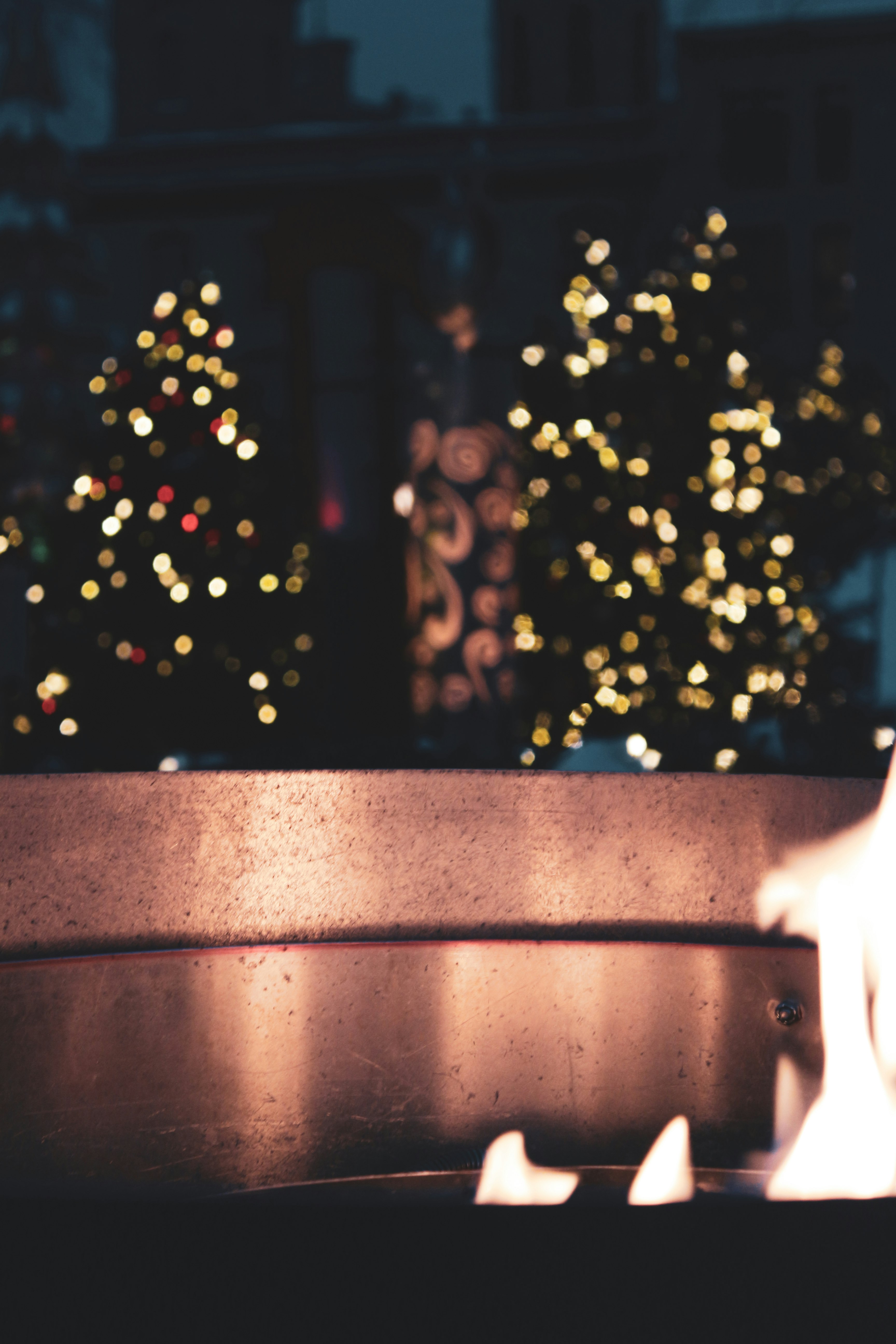 bokeh photography of brown wooden fence with string lights