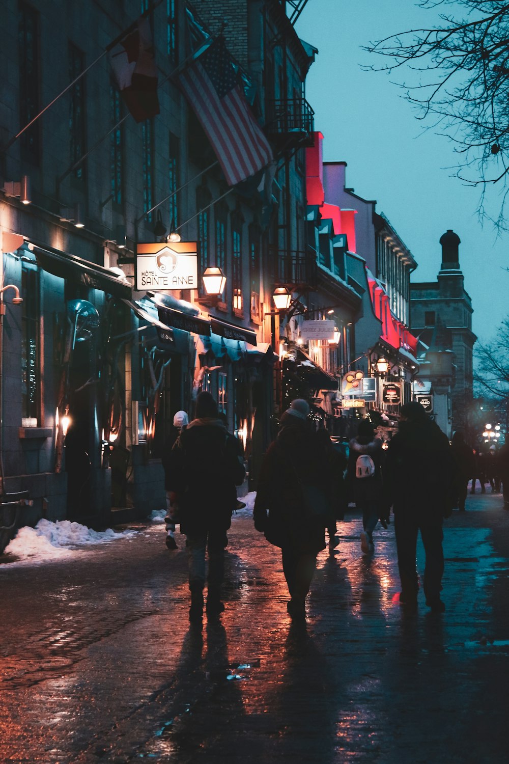 people walking on street during night time