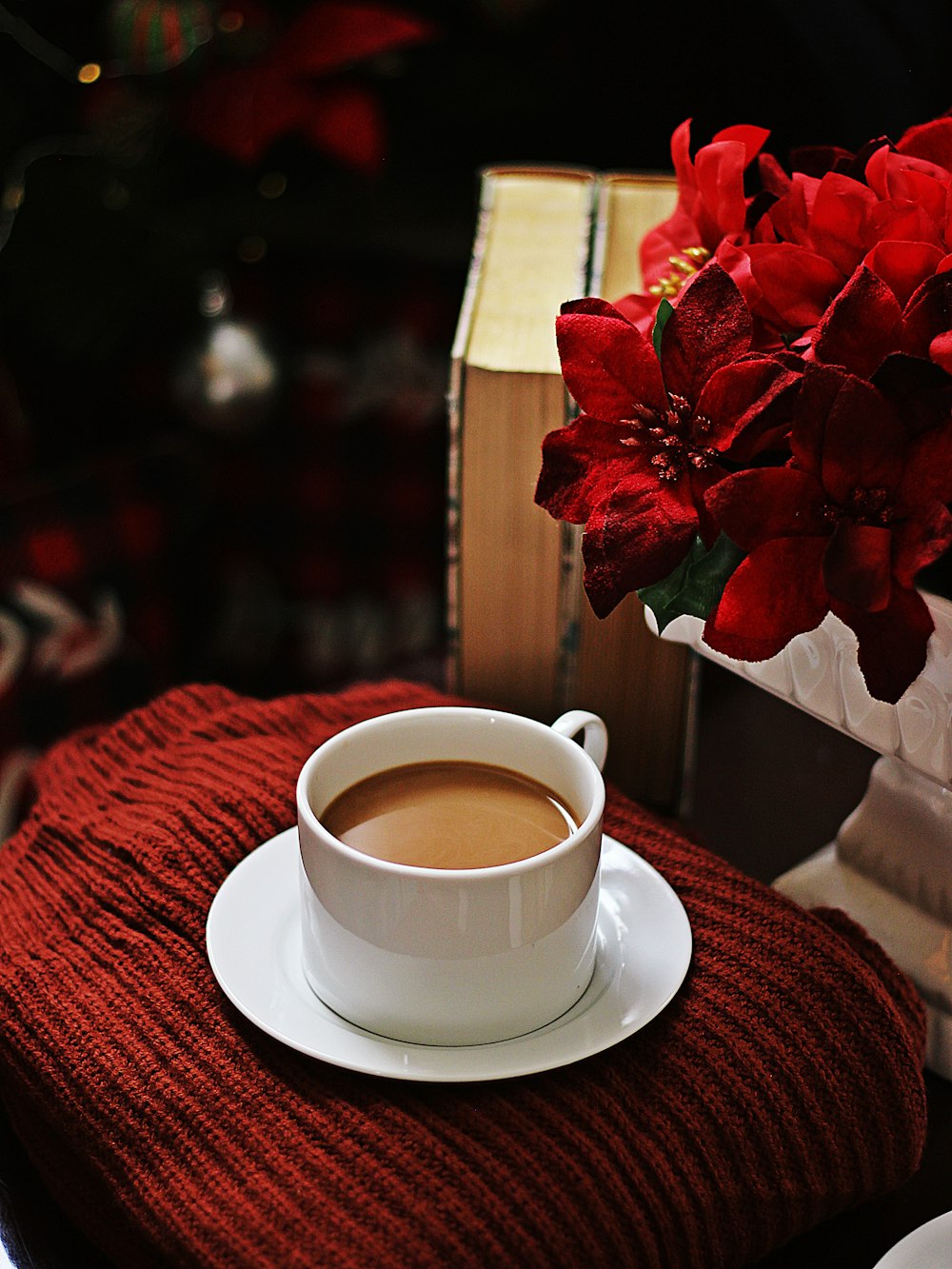 white ceramic cup on white ceramic saucer