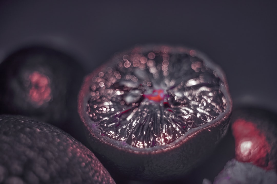 red round fruit in black background