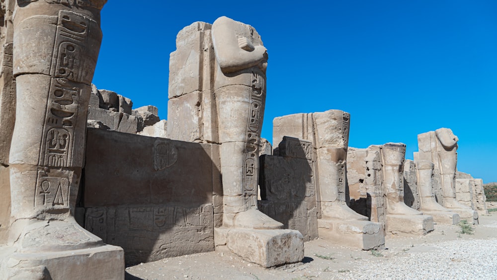 brown concrete statue under blue sky during daytime