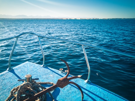 brown metal pipe on blue sea during daytime