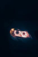 Before and after comparison of a car headlight restoration.