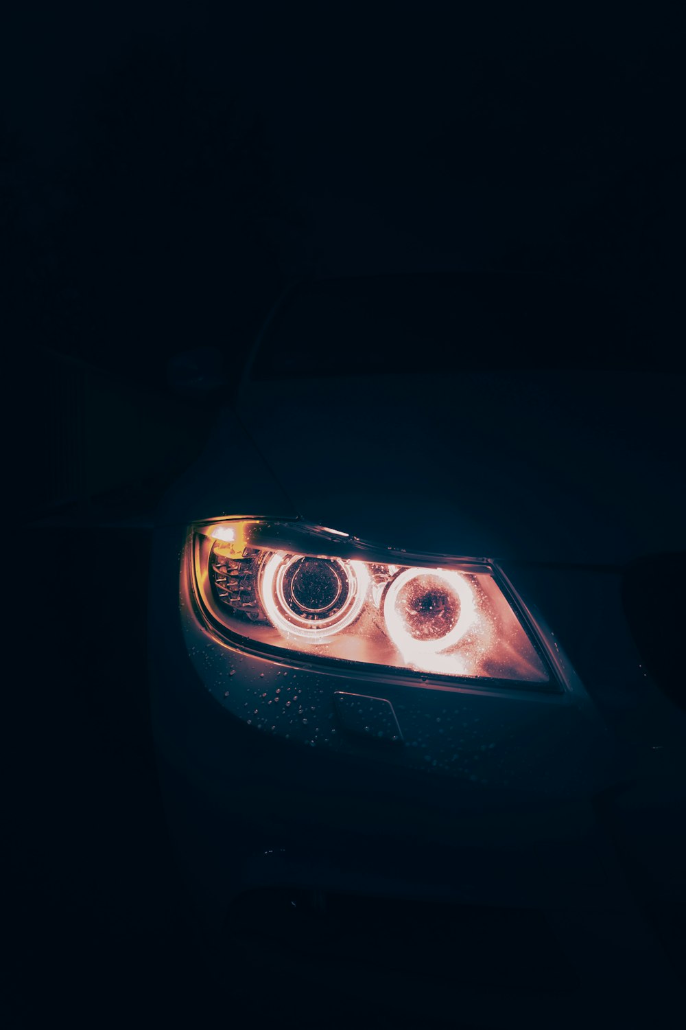 the headlights of a car in the dark