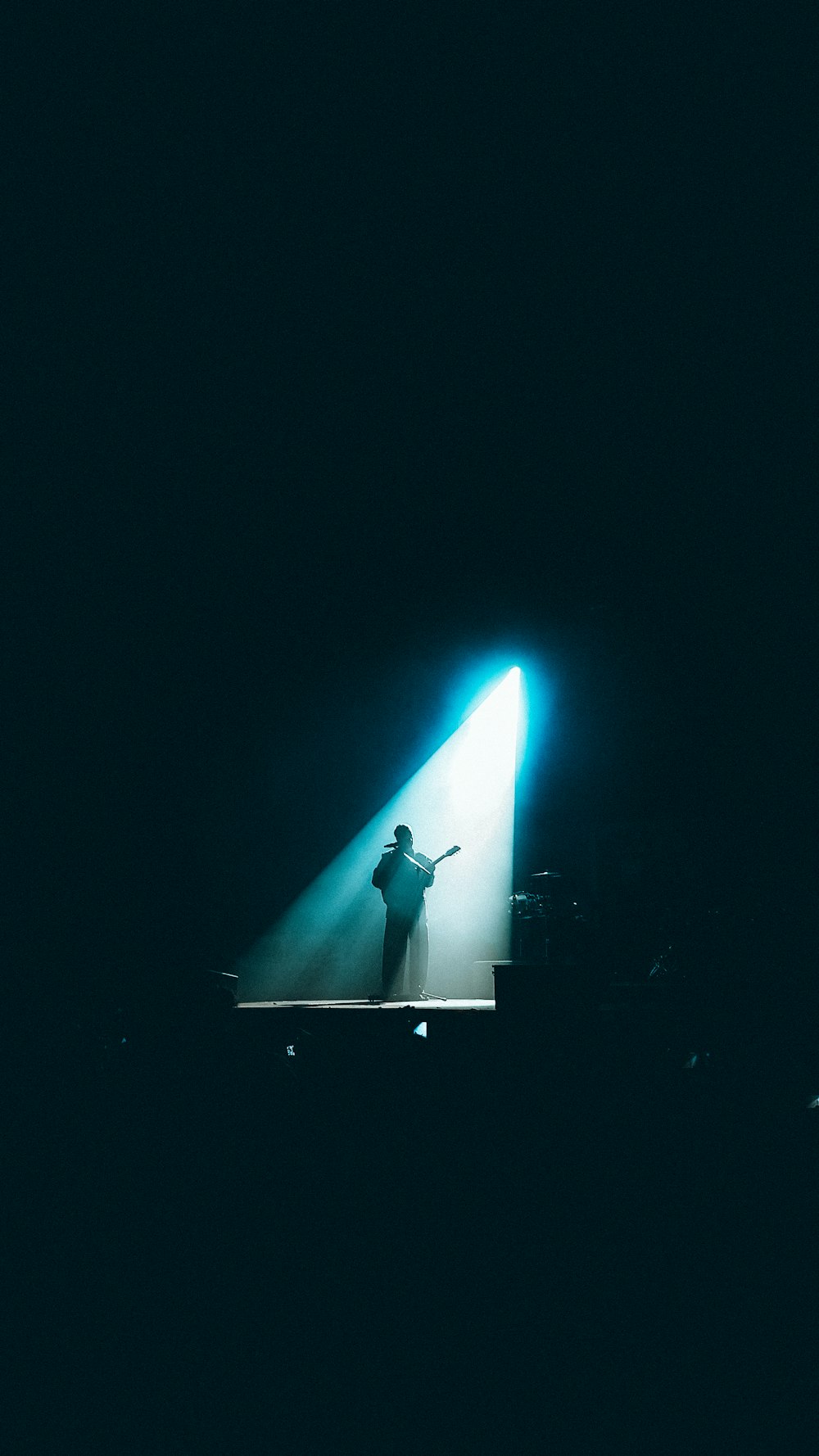 man in black shirt standing on the ground