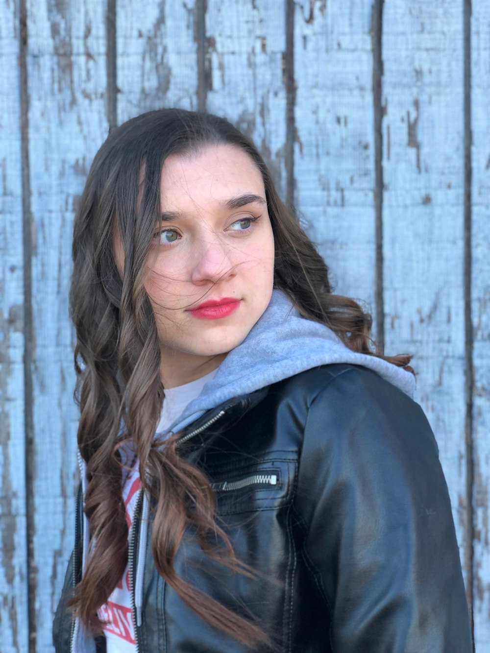 woman in black leather jacket smiling