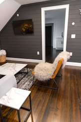 white fur textile on brown wooden chair