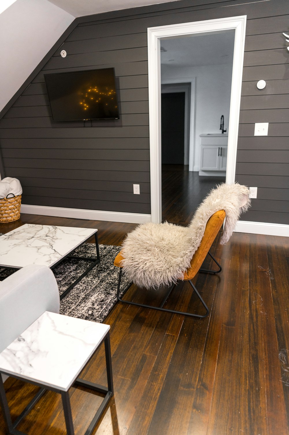 white fur textile on brown wooden chair