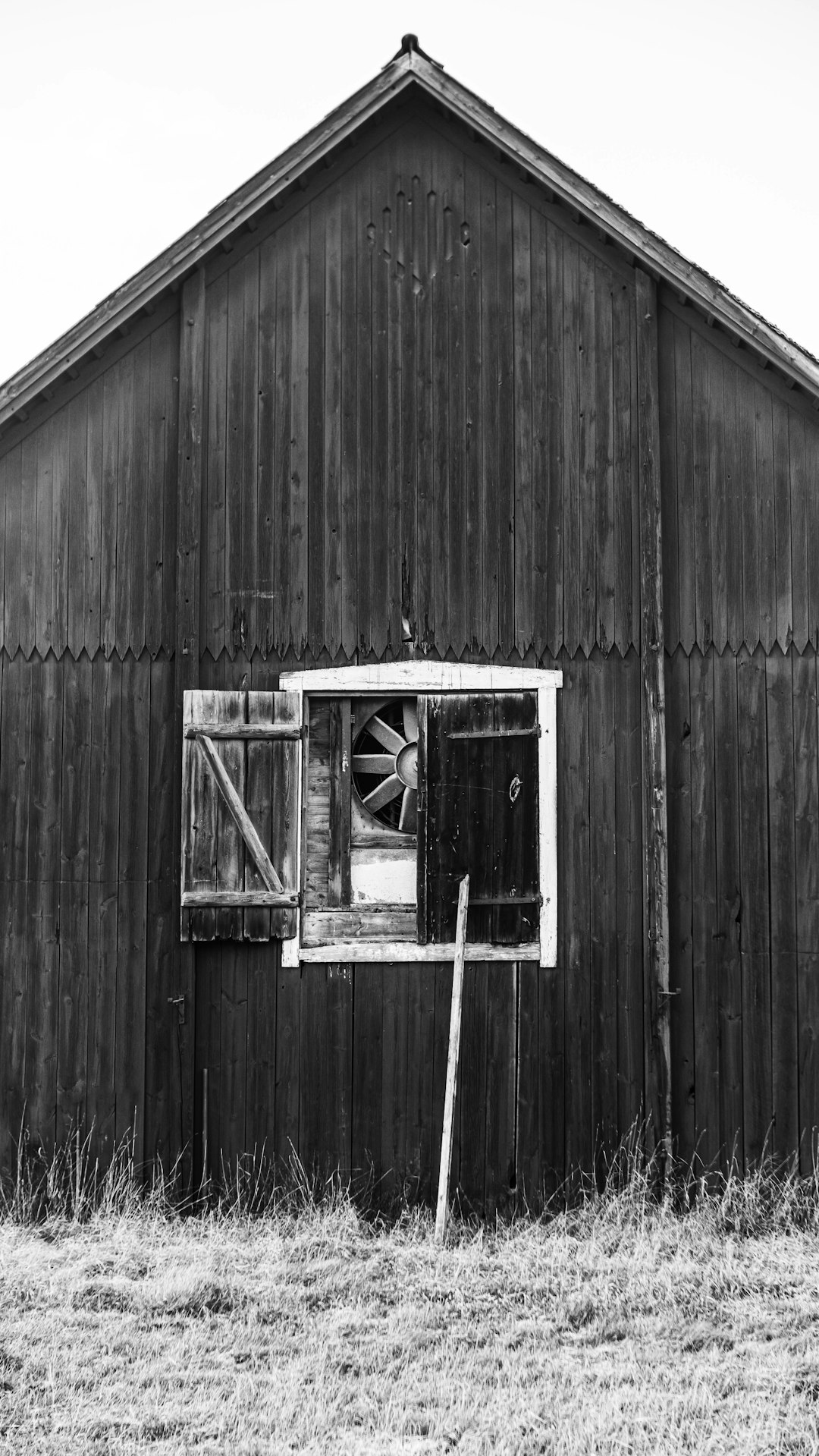 brown wooden house with white window type ac unit