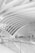 A modern architectural interior with sweeping, curved beams creating an open and spacious atmosphere. The area is dominated by sleek staircases and transparent glass railings, all in a monochromatic scheme. The design is minimalistic and emphasizes clean lines and geometric shapes.