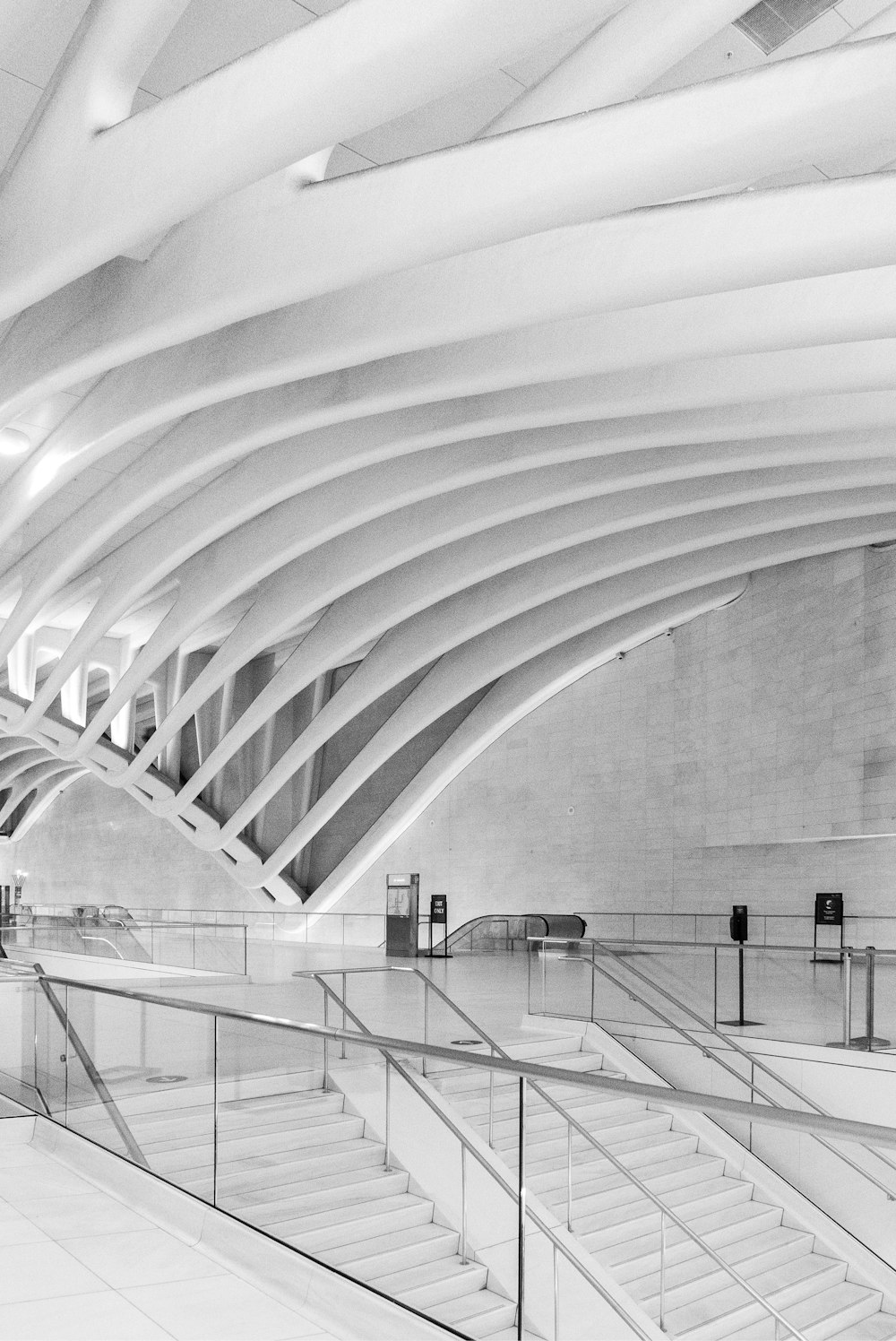 grayscale photo of a tunnel