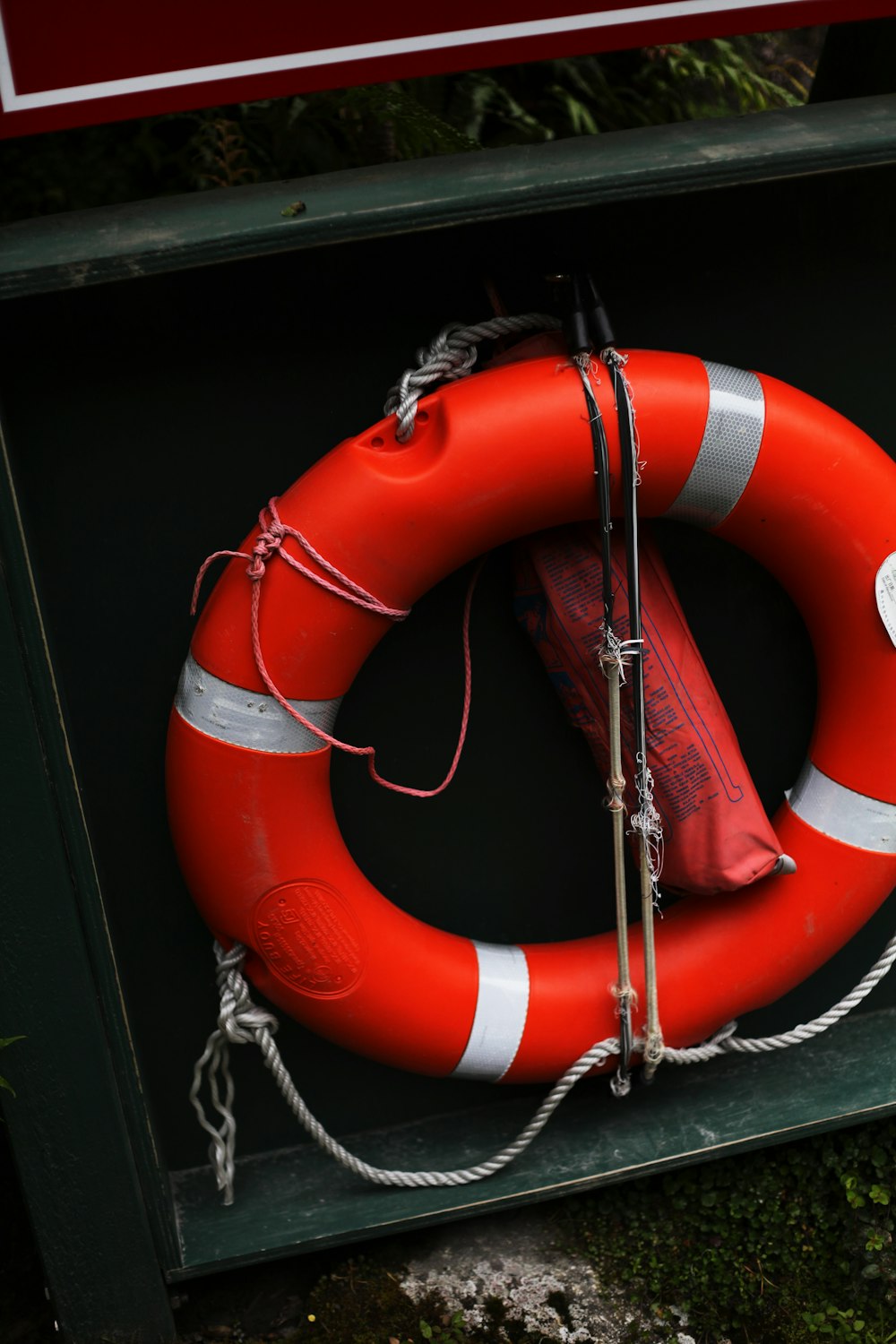 orange and white inflatable life buoy