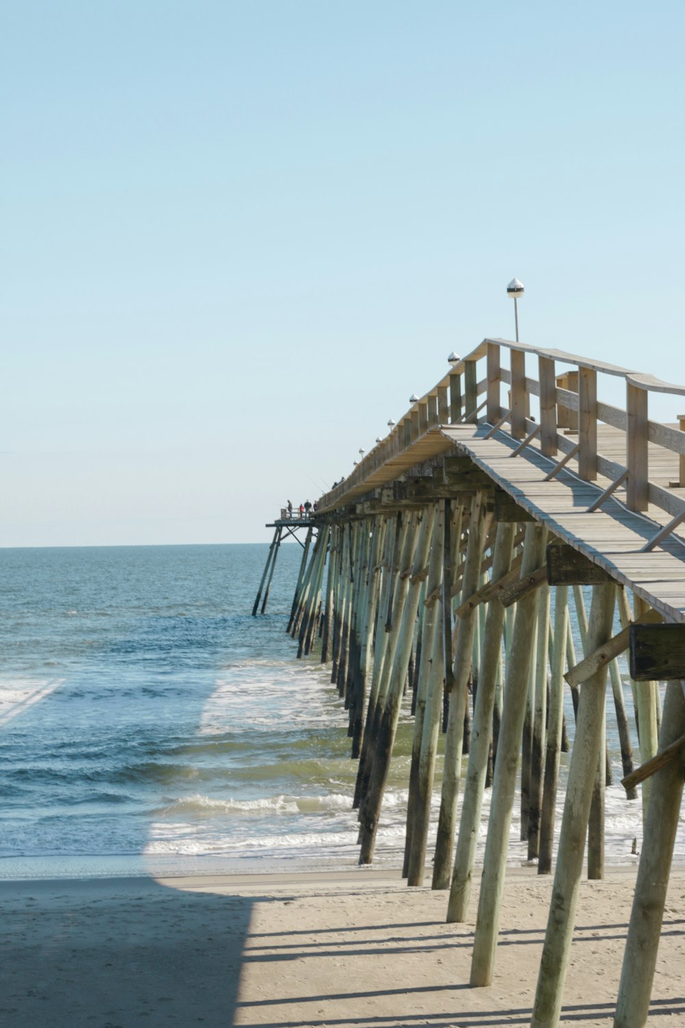 brown wooden dock on sea during daytime