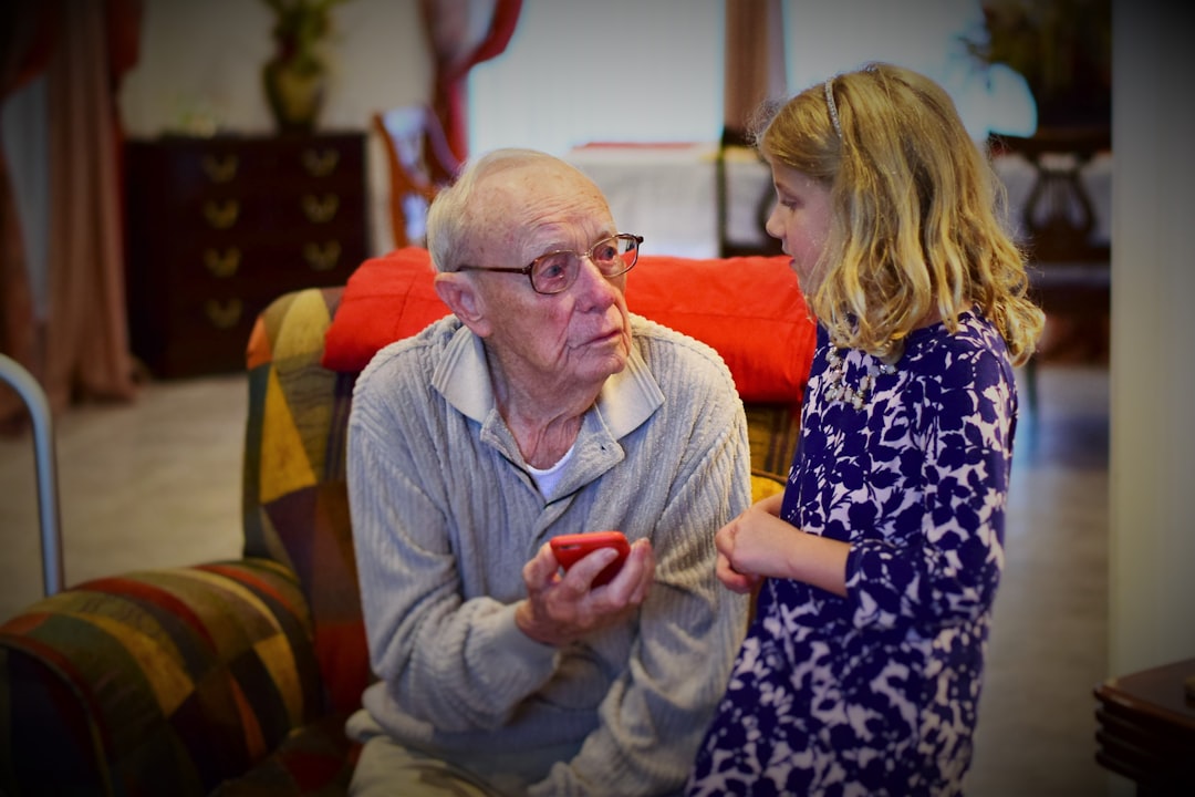 Caregiver using tablet with senior for video call with family - Alzheimer's care at home Caregiver using tablet with senior for video call with family - Alzheimer's care at home