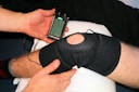 person holding black knit cap