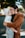 woman in brown coat hugging woman in white knit cap
