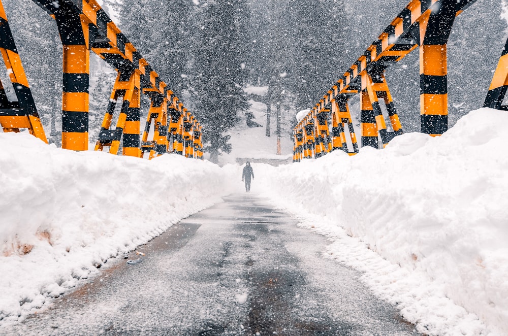 snow covered road during daytime