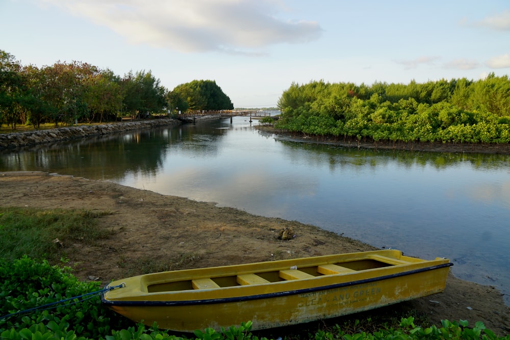 brown wooden boat on lake during daytime