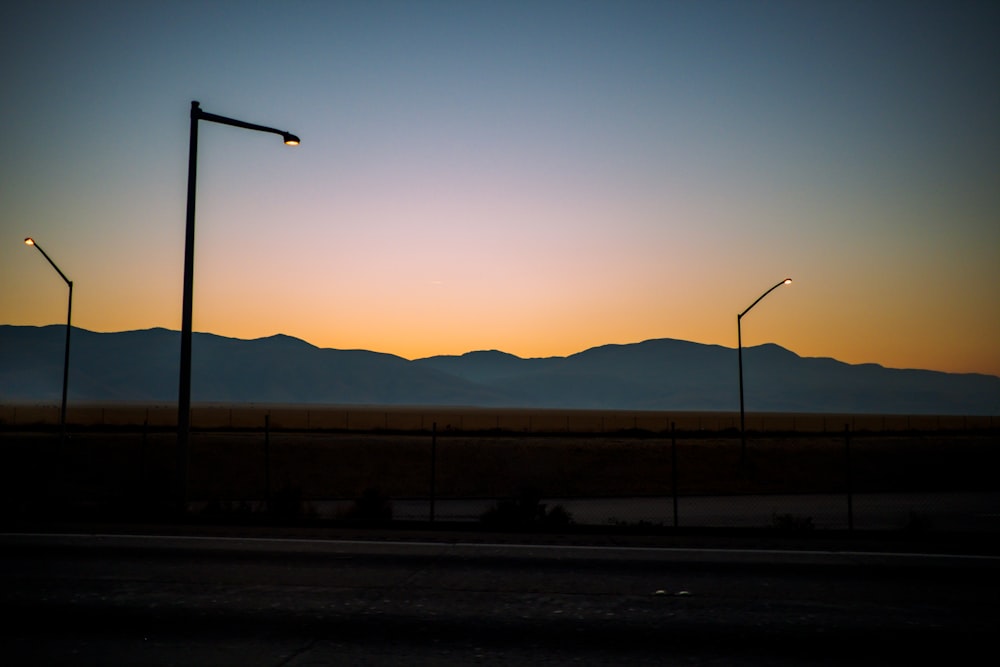 silhouette of street light during sunset