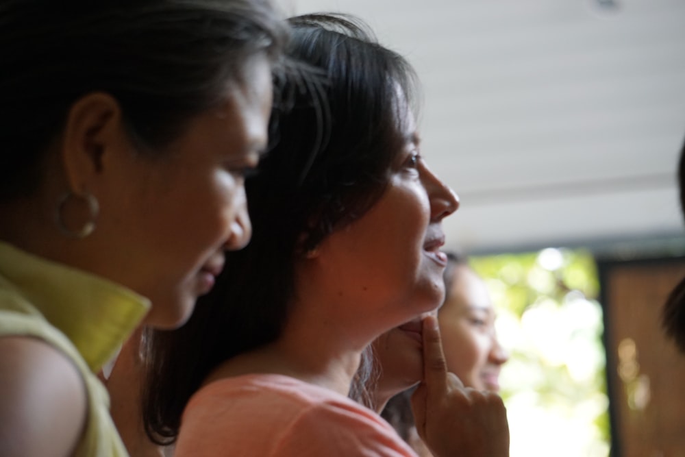 woman in white shirt kissing woman in white shirt