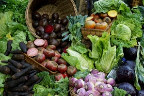 green and red vegetable on brown woven basket