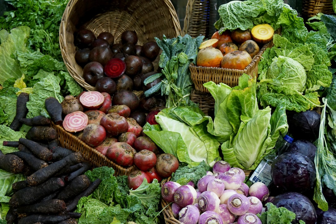 green and red vegetable on brown woven basket,