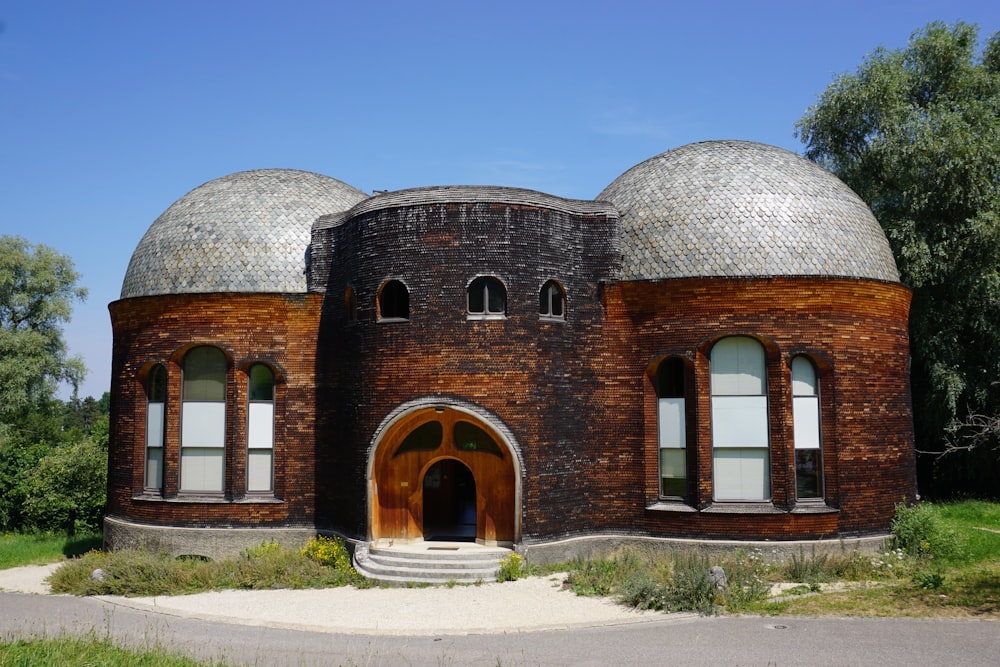 brown brick building under blue sky during daytime