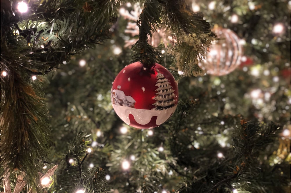 pink and white baubles on green christmas tree