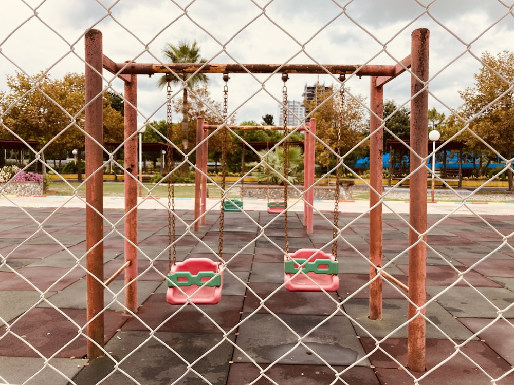 a playground with swings and swings in a park