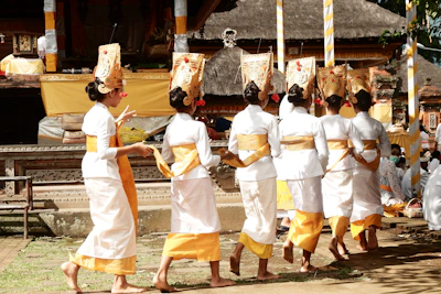 Banjar Hitakarma leaders in traditional attire during a cultural event.