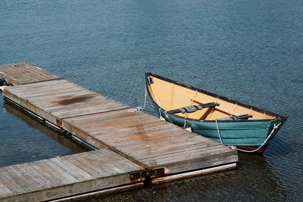 brown wooden dock on body of water during daytime