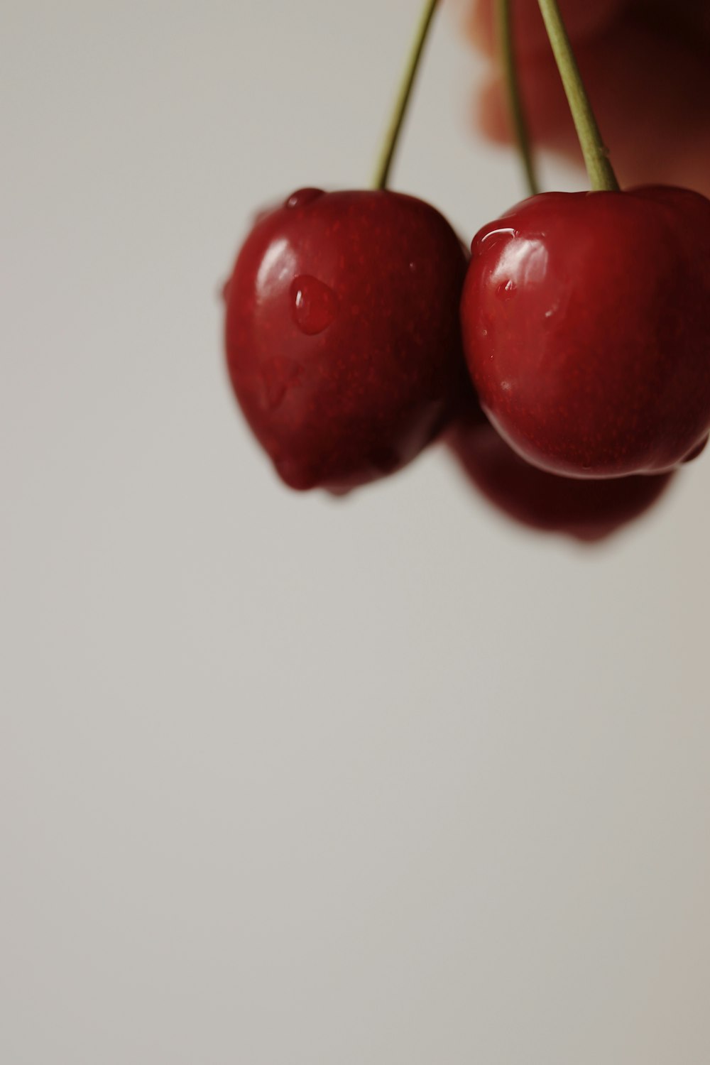 red fruit on white surface
