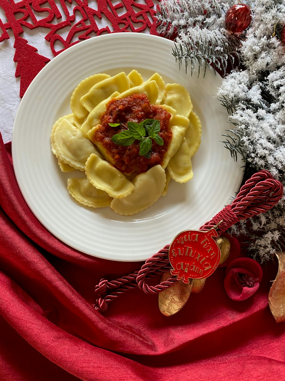 yellow and red food on white ceramic plate