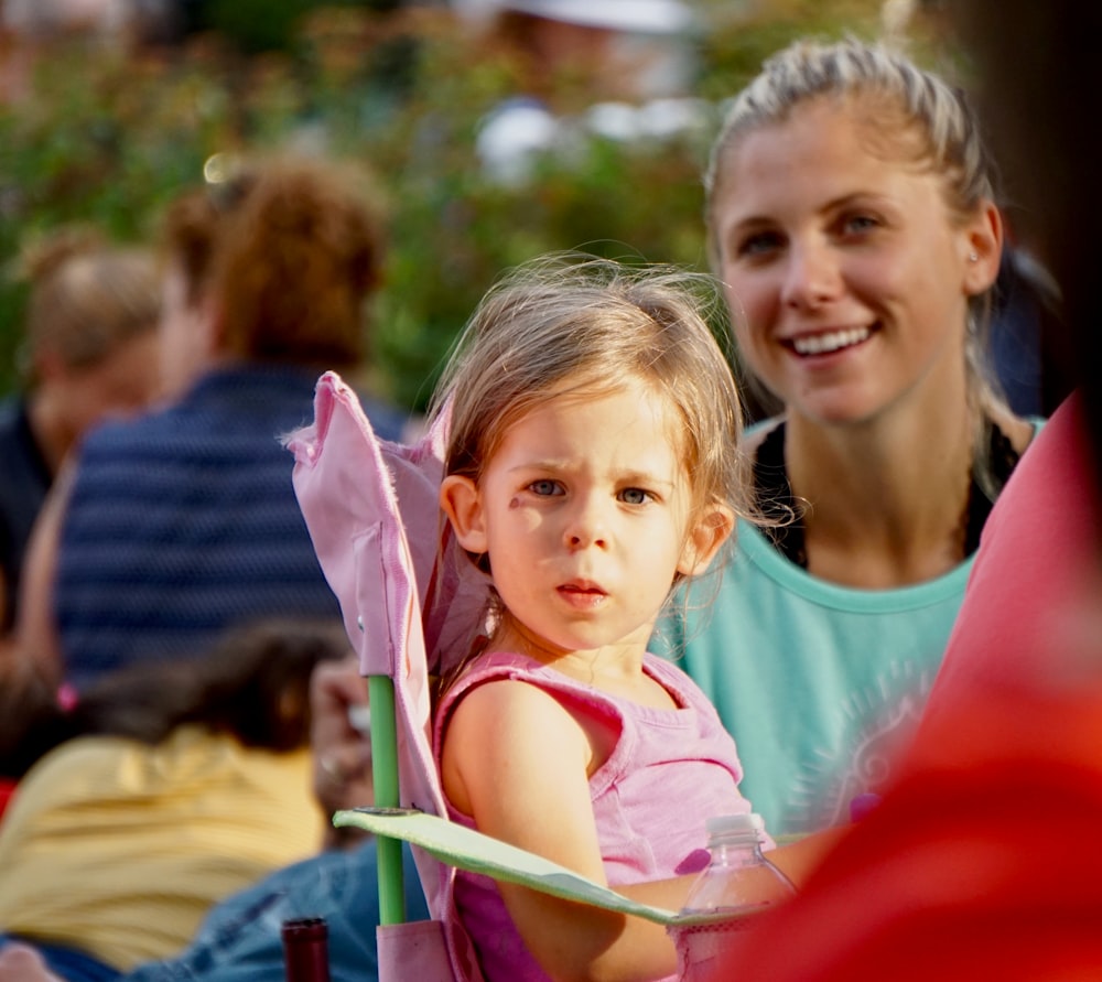 girl in pink tank top beside girl in pink tank top