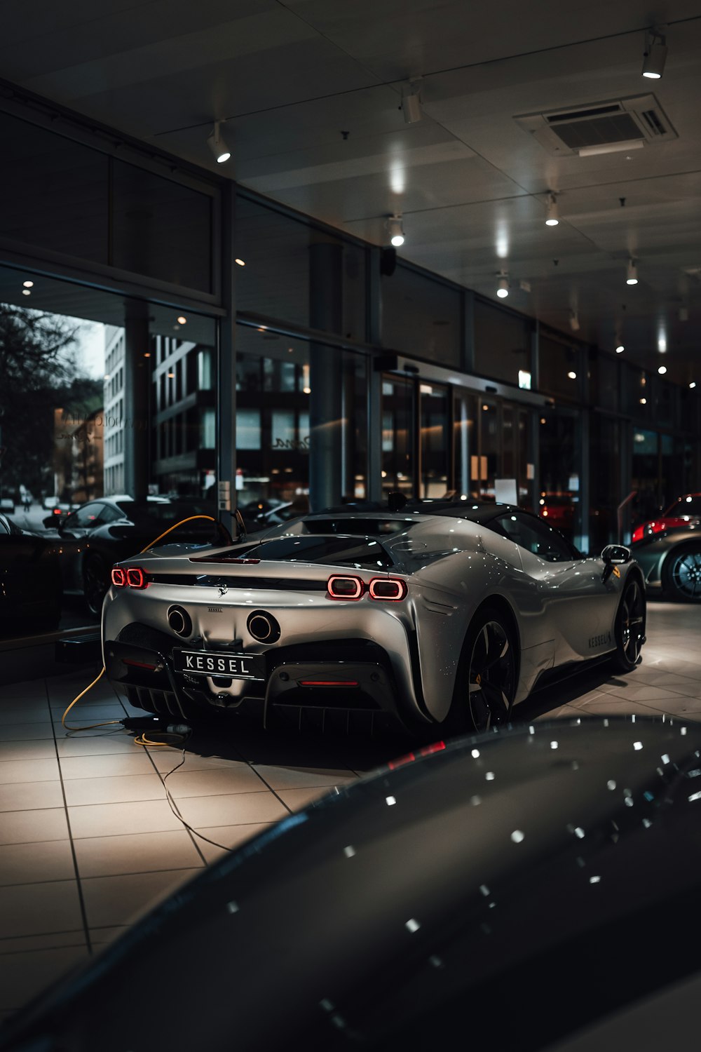 cars parked in front of building during night time