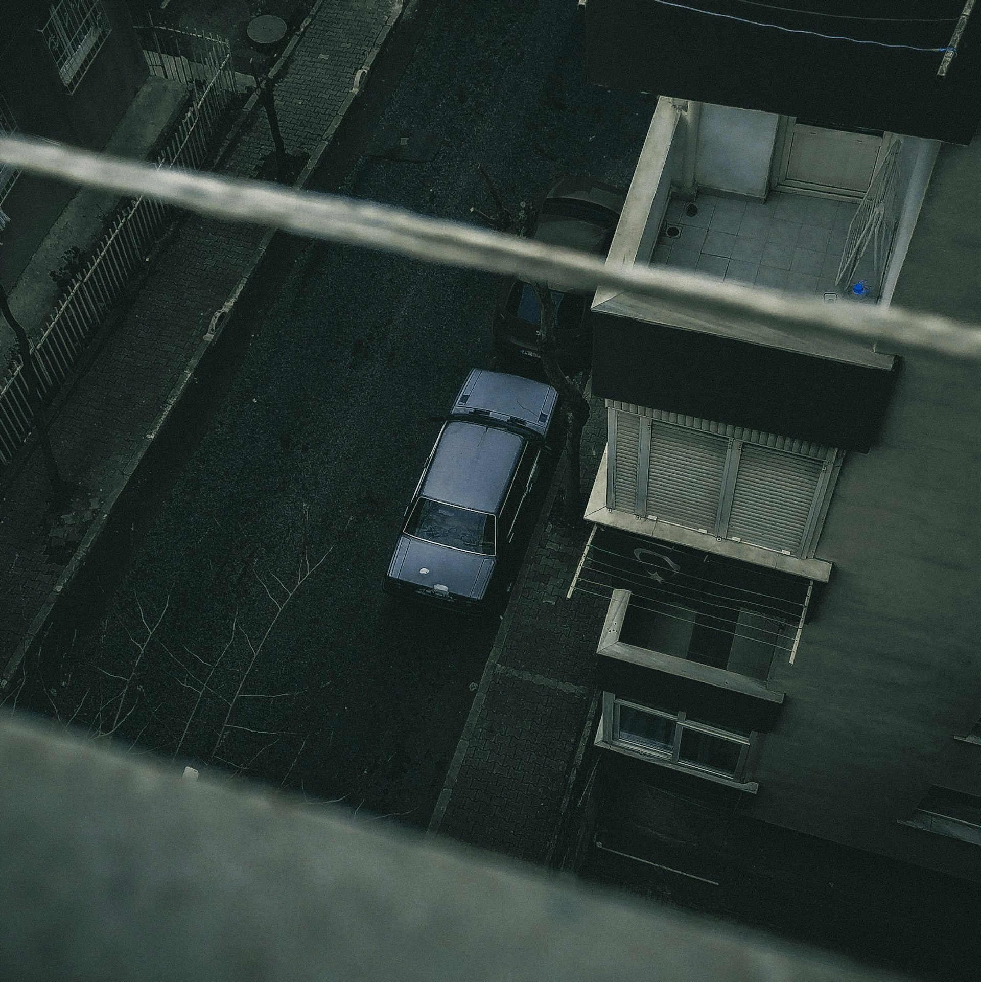 white car parked on parking lot during daytime