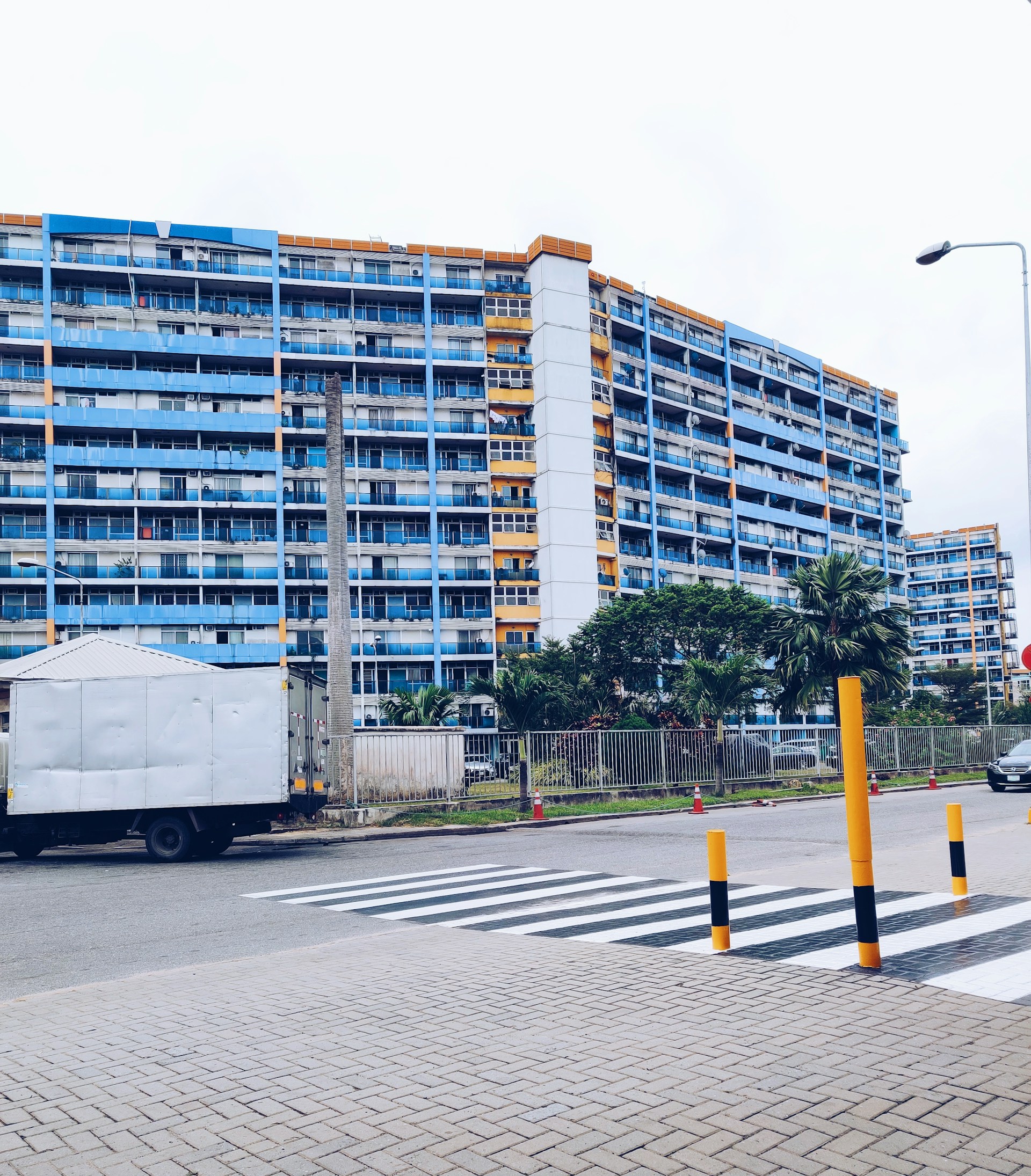 woman wearing yellow long-sleeved dress under white clouds and blue sky during daytime