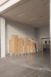 brown cardboard boxes on white floor tiles