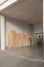 brown cardboard boxes on white floor tiles